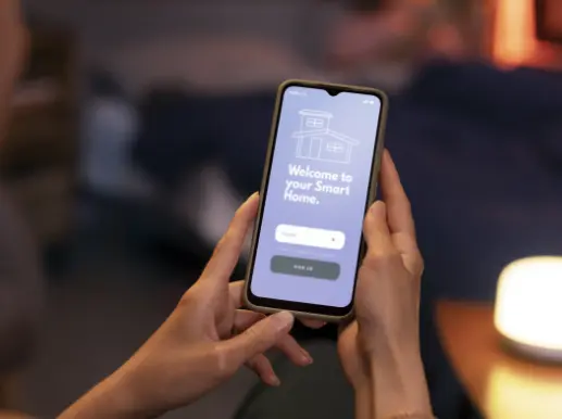 Hand holding mobile phone with LoadFinder app